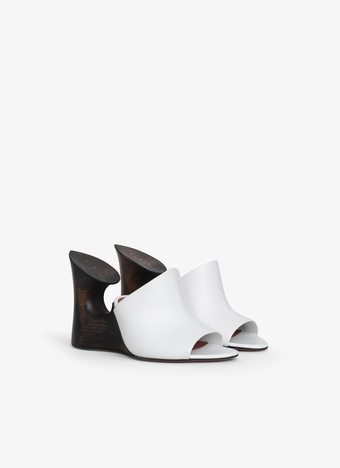 La Sculpture mules in calfskin & wood ALAÏA OFF-WHITE LA SCULPTURE MULES IN CALFSKIN & WOOD